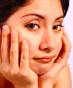 Girl With Her Head In Her Hands Sad And Unhappy About Something