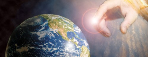 hand reaching out and touching earth