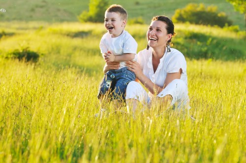 happy young woman mother play and outdoor with beautiful child